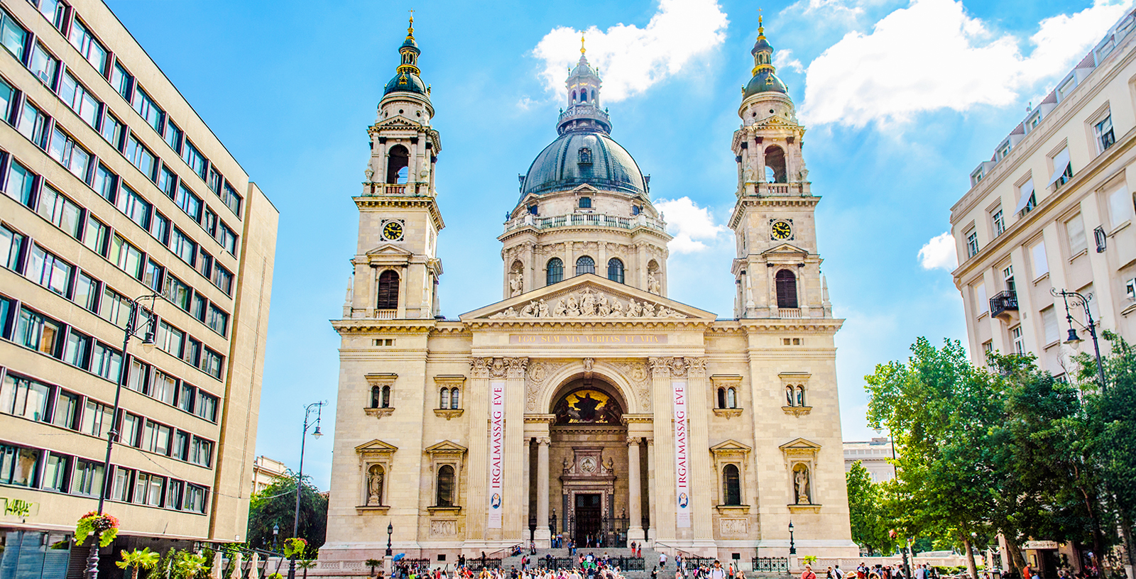 St. Stephen's Basilica exterior with tourists in Budapest, Hungary.