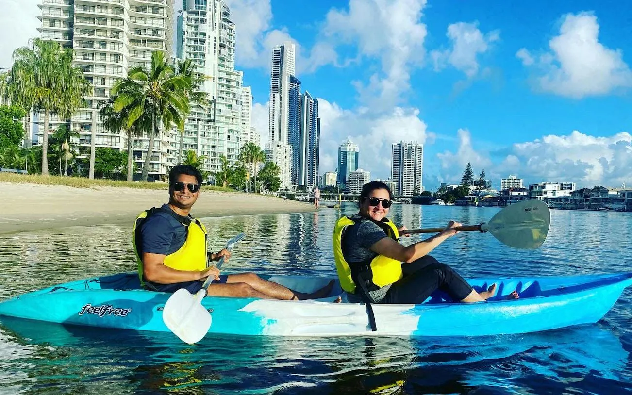 Kayakers on Surfers Paradise Guided Sunset Kayak Tour, Gold Coast with city skyline.