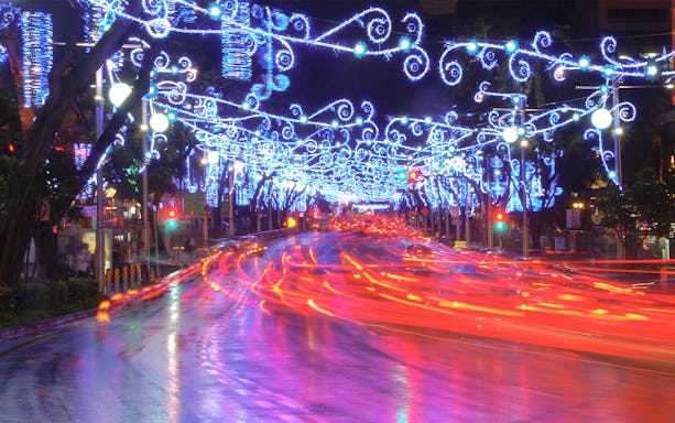 Singapore street adorned with vibrant Christmas lights during the Light Up Tour.