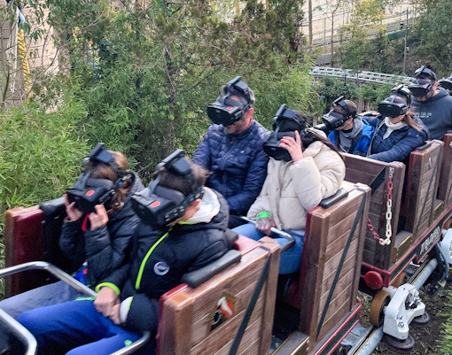 Visitors wearing VR headsets on Tibidabo Express ride in Barcelona.