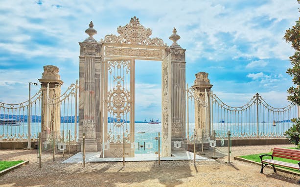 White gate overlooking the Bosphorus at Dolmabahce Palace, Istanbul, Turkey.