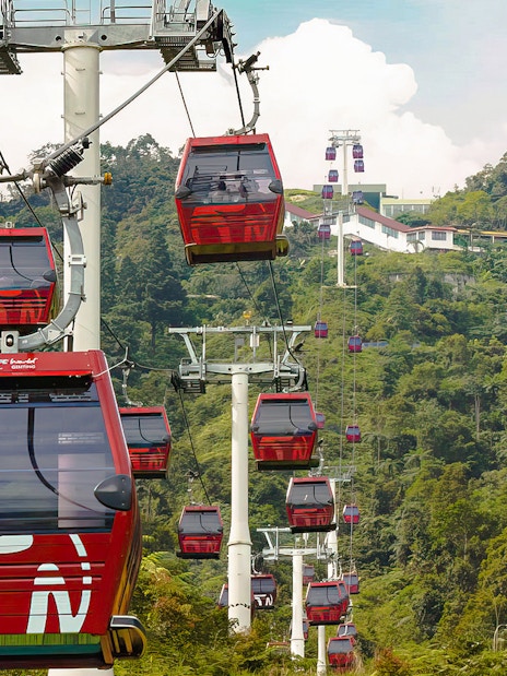 Genting Awana SkyWay gondola cable cars with Chin Swee Caves Temple in the background.