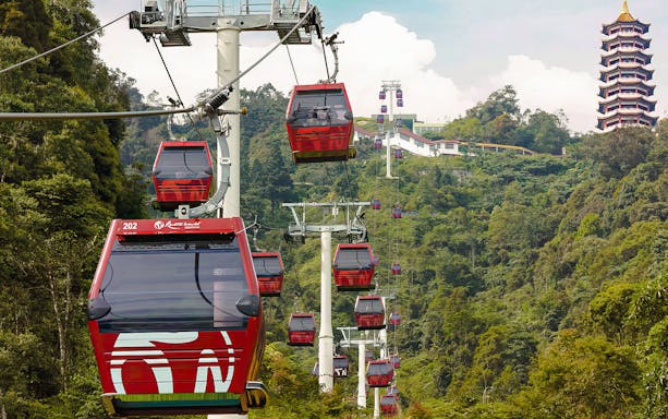 Genting Awana SkyWay gondola cable cars with Chin Swee Caves Temple in the background.