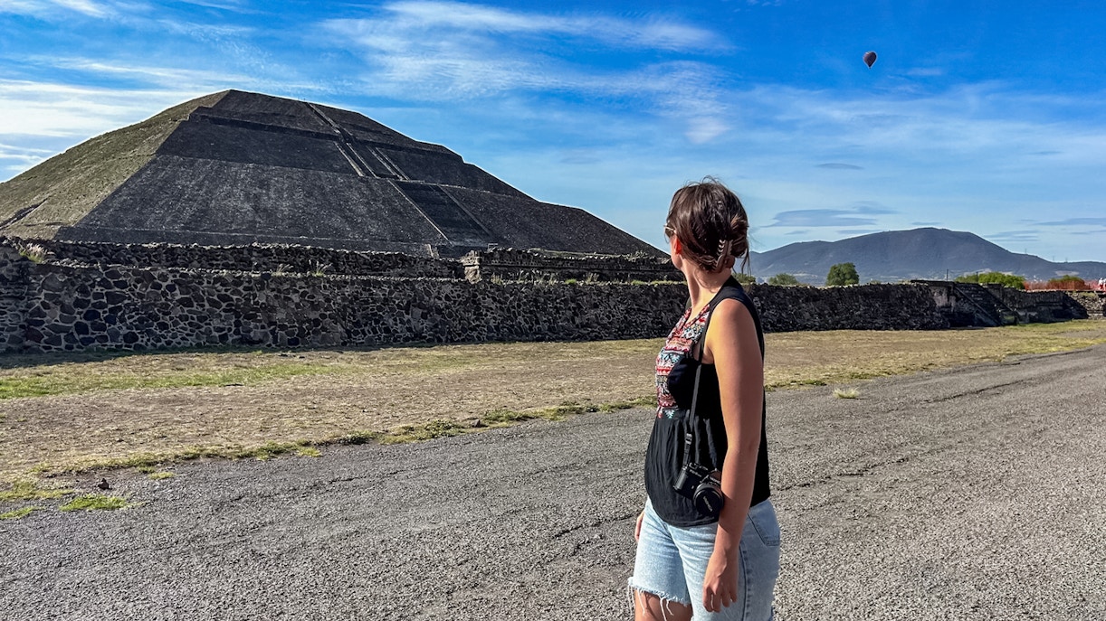 Teotihuacan Pyramid of the Sun with tourists exploring the ancient site in Mexico.