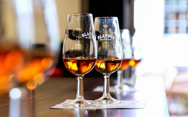 Wine glasses with Madeira wine at a tasting in Funchal, Madeira.