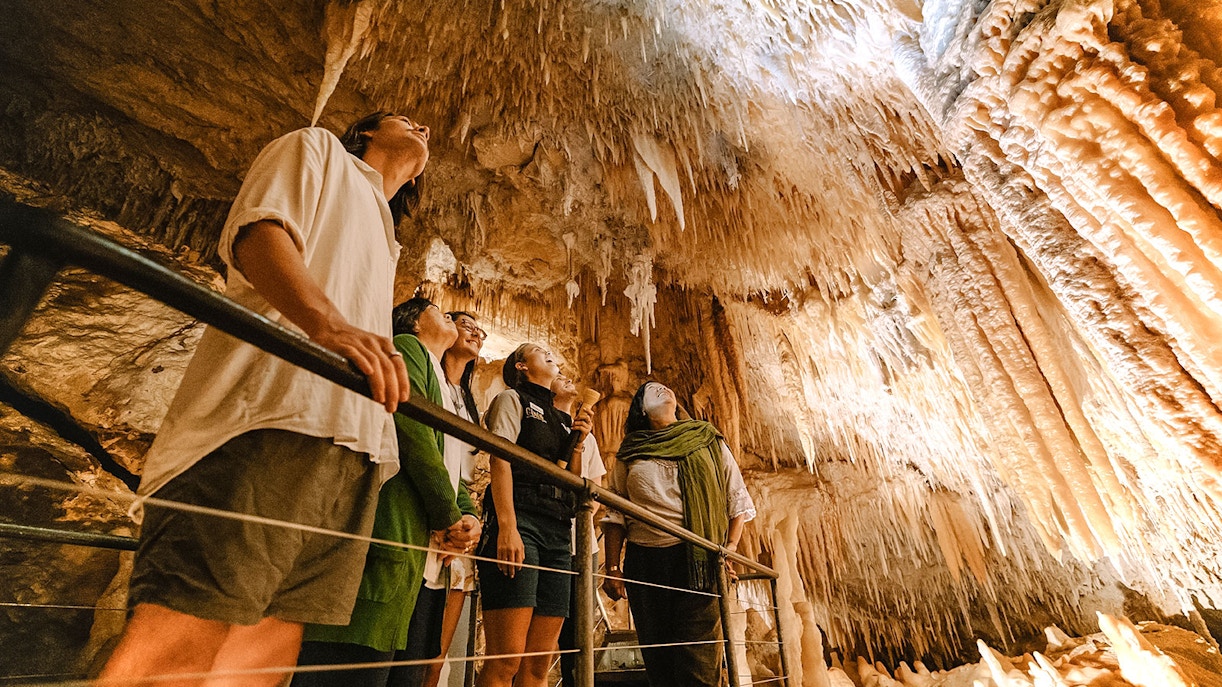 Tourists looking at the formation inside the cave