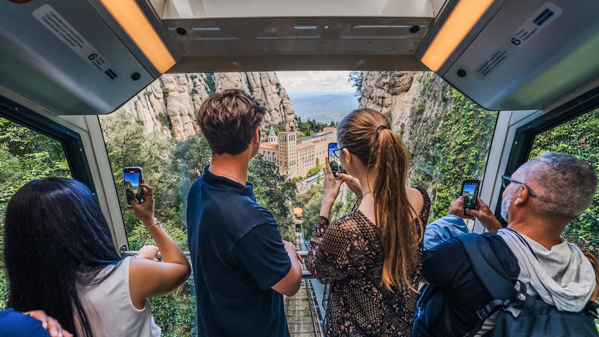 Tourists on train to montserrat monastery