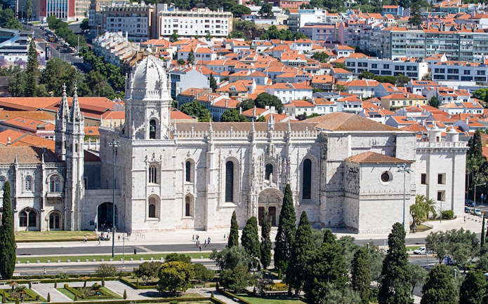 Jerónimos Monastery in Lisbon with surrounding cityscape.