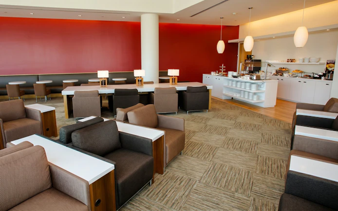 Seating area and buffet at Plaza Premium Lounge, Terminal 3, Toronto Pearson Airport.