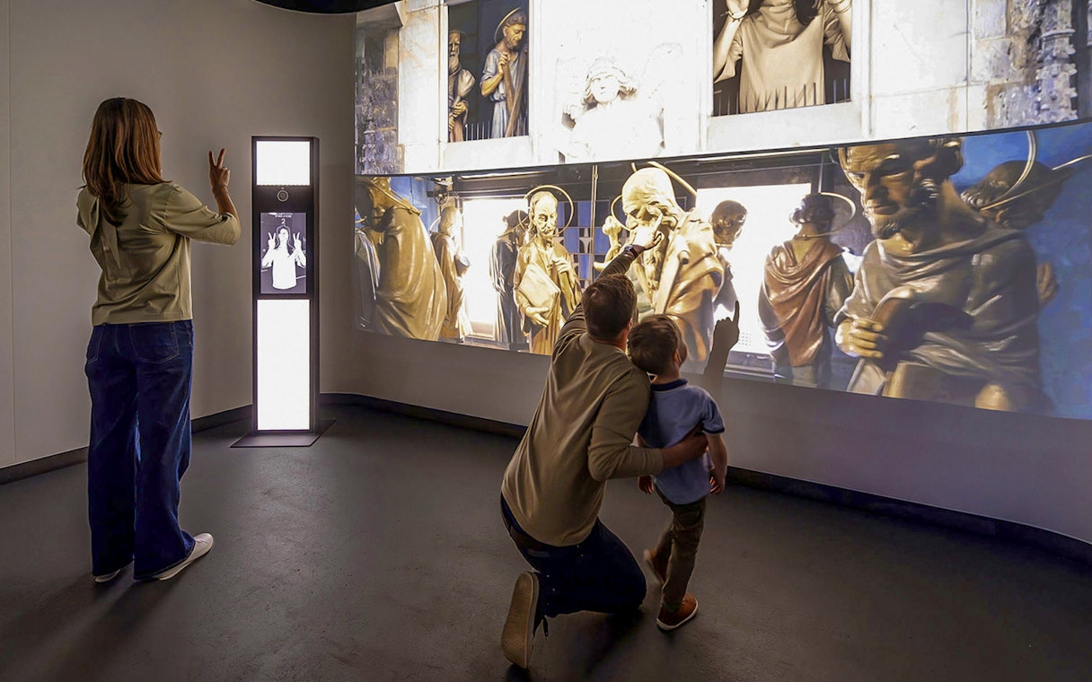 Guests interacting with digital exhibits at Praga Magica Interactive Exhibition.