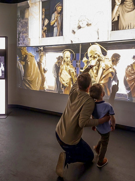Guests interacting with digital exhibits at Praga Magica Interactive Exhibition.