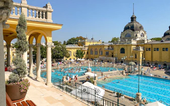 Szechenyi Baths outdoor pools with historic architecture in Budapest, Hungary.