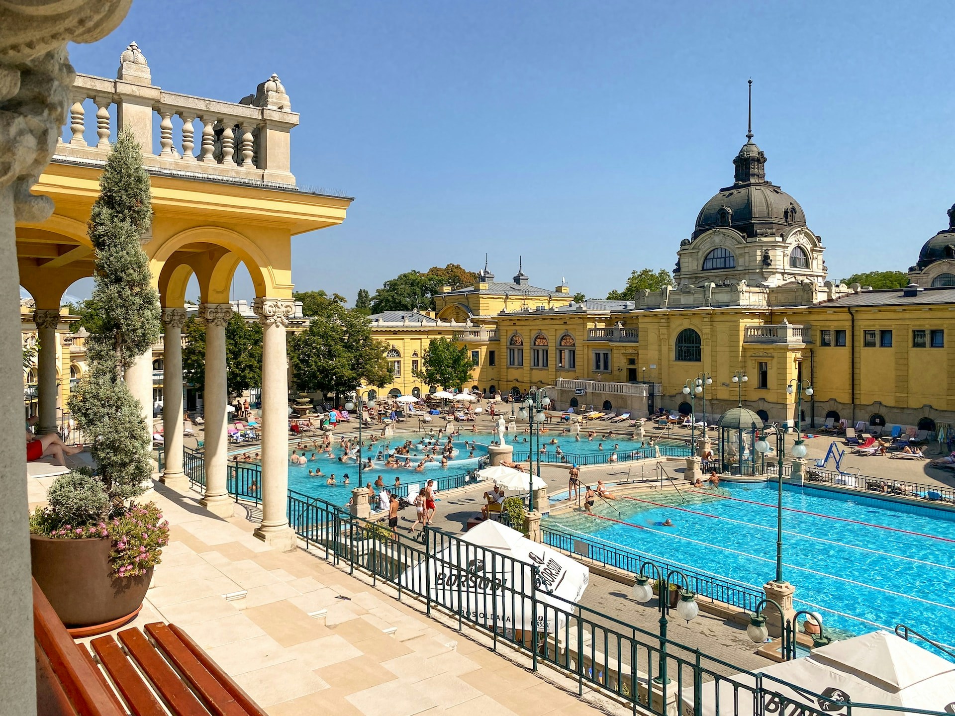 Szechenyi Baths thermal pools in Budapest with people enjoying the warm waters.
