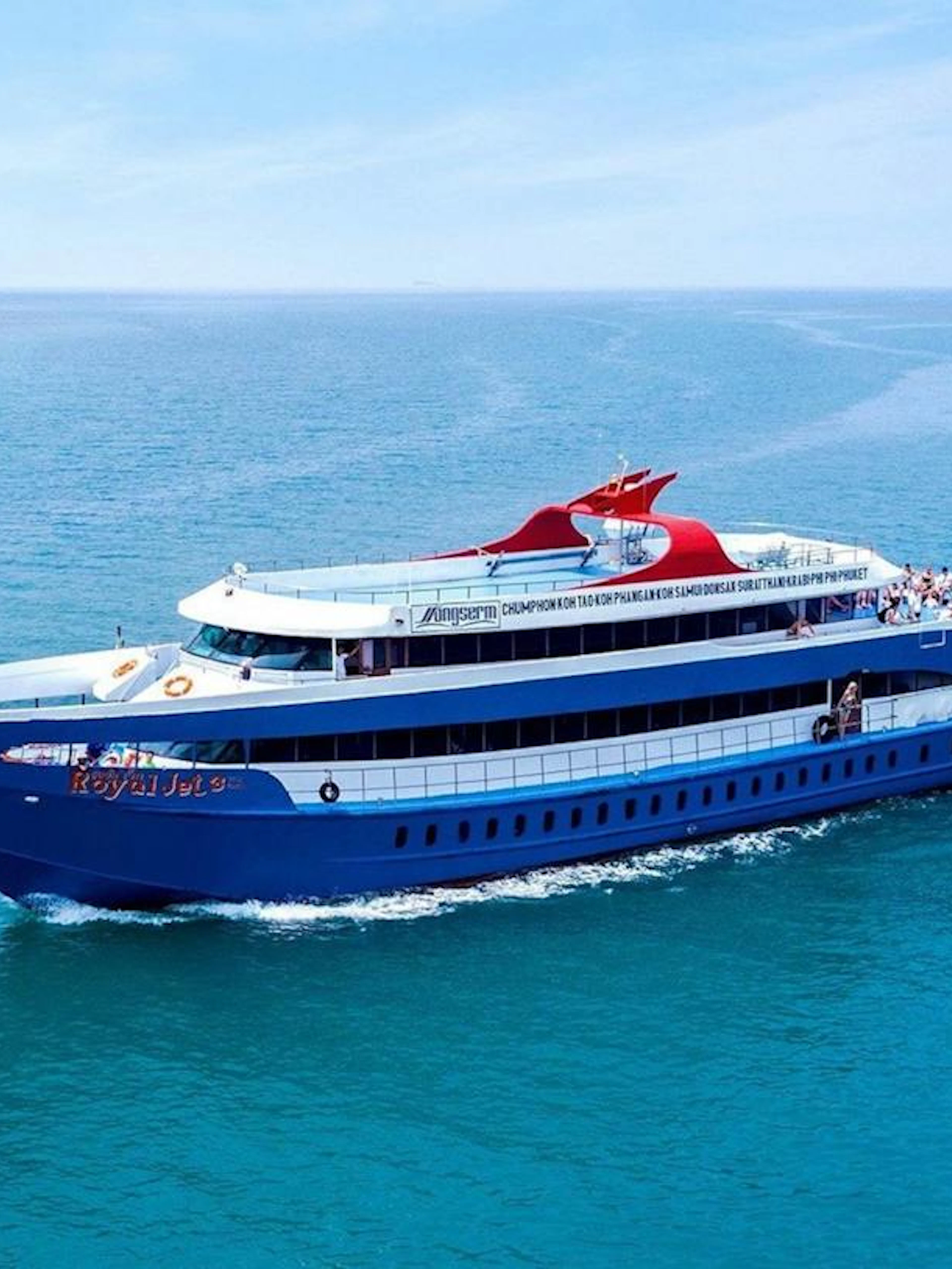 Ferry cruising from Phuket Pier to Phi Phi Islands across clear blue waters.
