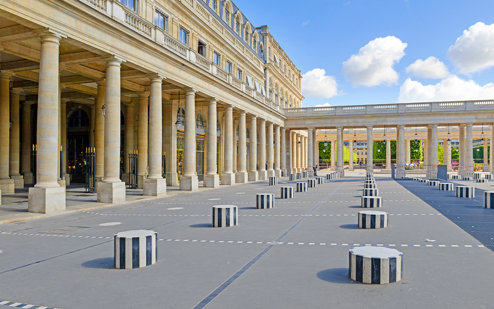 Palais Royal courtyard with striped columns in Paris, France.