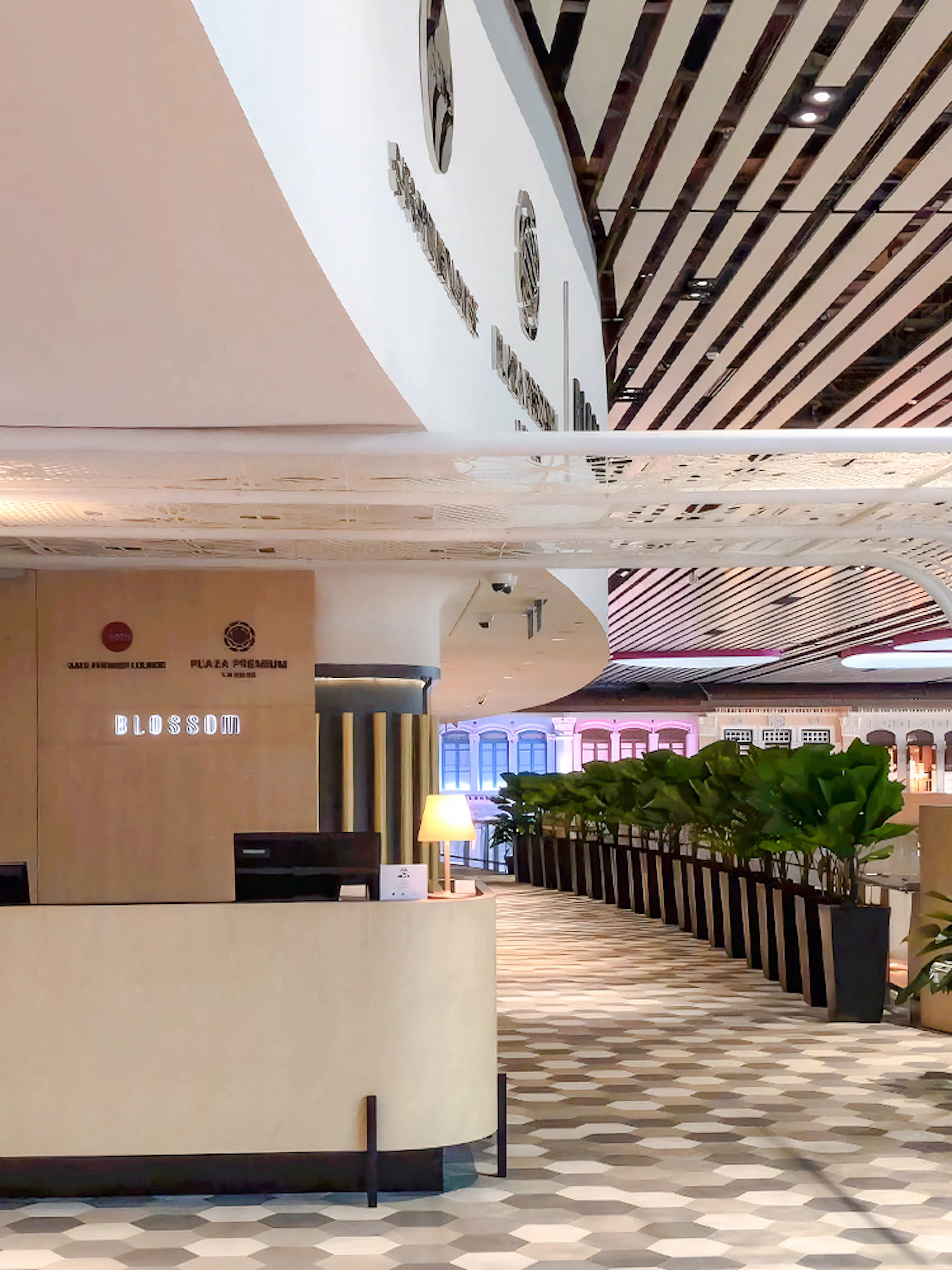 BLOSSOM by SATS reception area at Plaza Premium Lounge, Singapore Changi Airport.