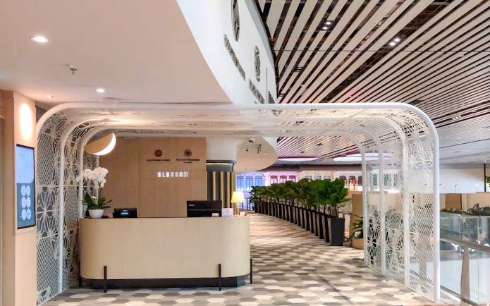 BLOSSOM by SATS reception area at Plaza Premium Lounge, Singapore Changi Airport.