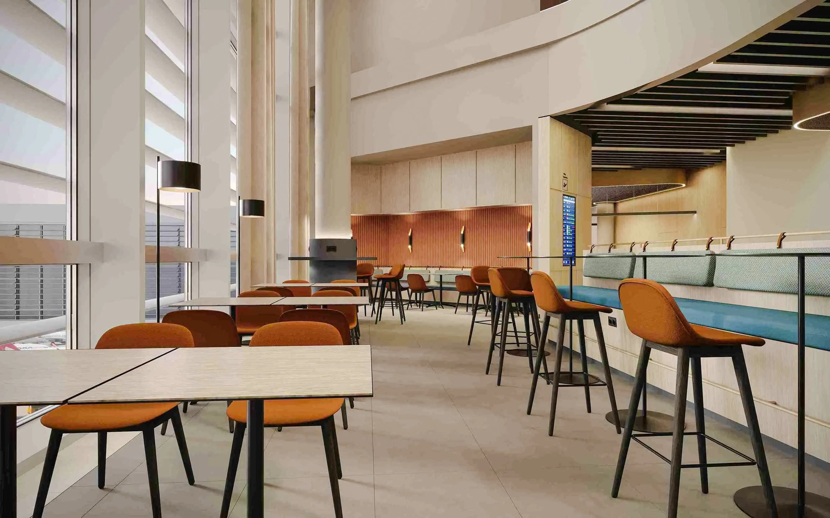 Munich Airport T1 non-Schengen lounge seating area with tables and chairs.