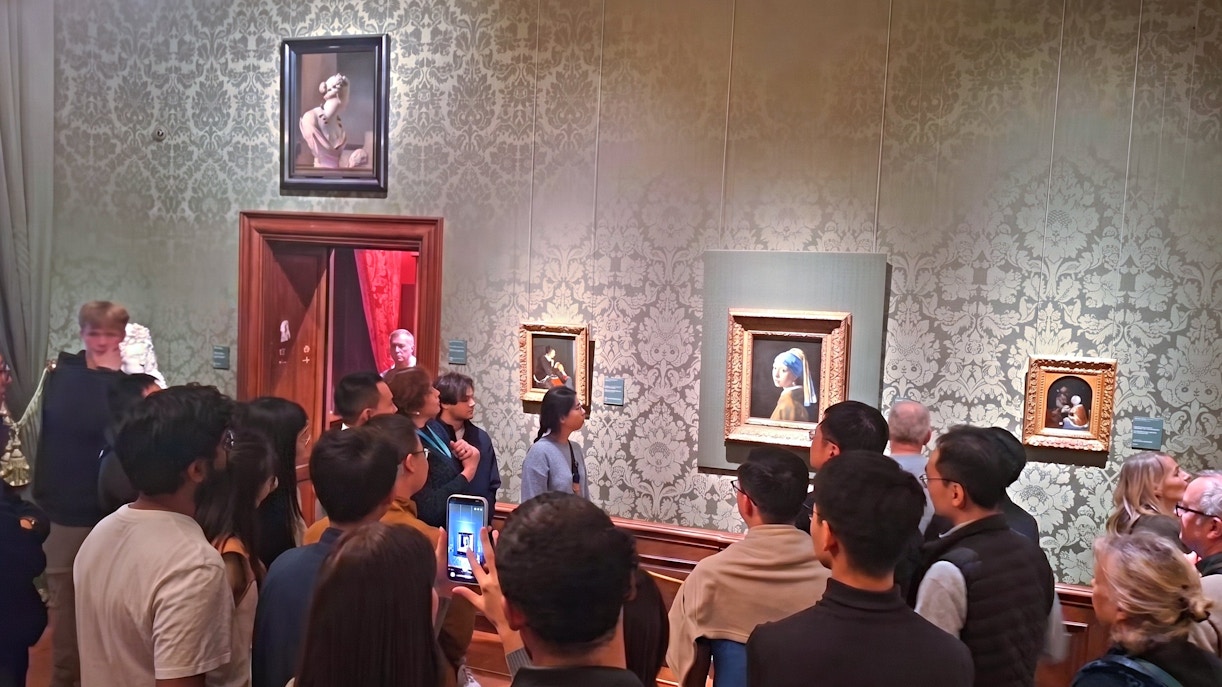 Visitors viewing "Girl with a Pearl Earring" at Mauritshuis, The Hague.