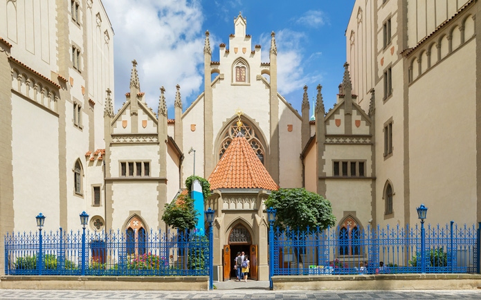 Prague Jewish Museum entrance with visitors, part of the Prague Card tour.