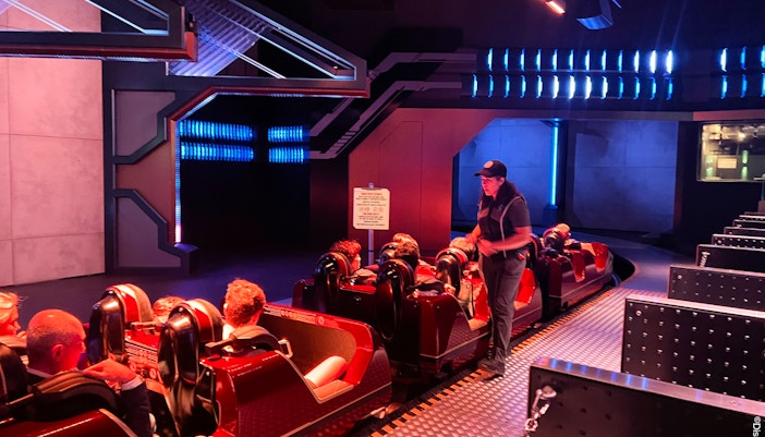 Guests seated on Avengers Assemble Flight Force ride at Disneyland Paris.