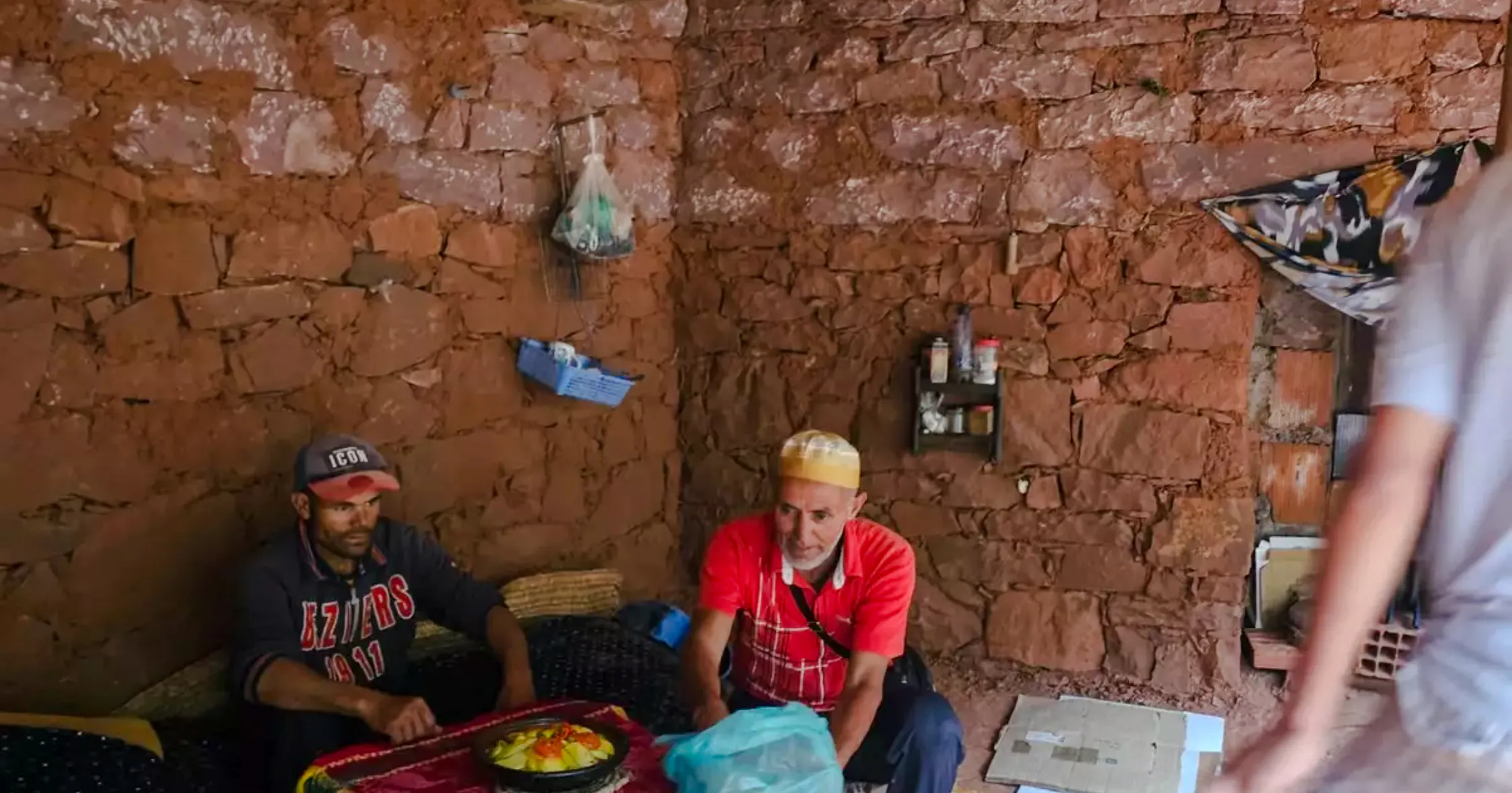 Local men preparing traditional meal in Anzro Eco-Village, Marrakesh.