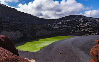 Charco de los Clicos green lagoon with volcanic cliffs, Lanzarote, Canary Islands, Spain.