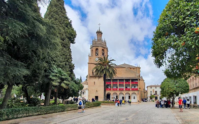 Guided tour group at the Church of Santa María la Mayor in Ronda, Spain.