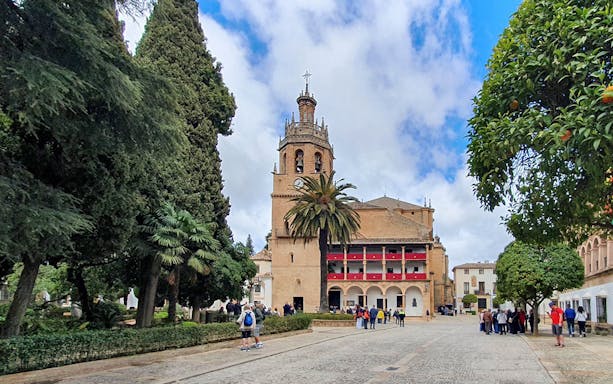 Guided tour group at the Church of Santa María la Mayor in Ronda, Spain.