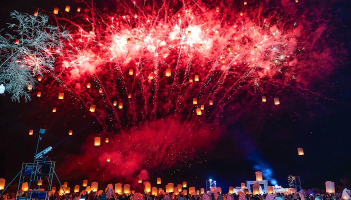 Fireworks and lanterns illuminate the night sky at Yi Peng and Loy Krathong Festival 2025.