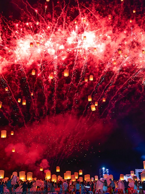 Fireworks and lanterns illuminate the night sky at Yi Peng and Loy Krathong Festival 2025.
