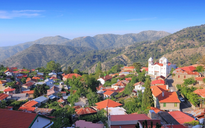 Pedoulas village with red-roofed houses and a church in Nicosia District, Cyprus.