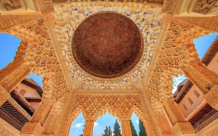 Alhambra's intricate ceiling in the Court of the Lions, Granada.