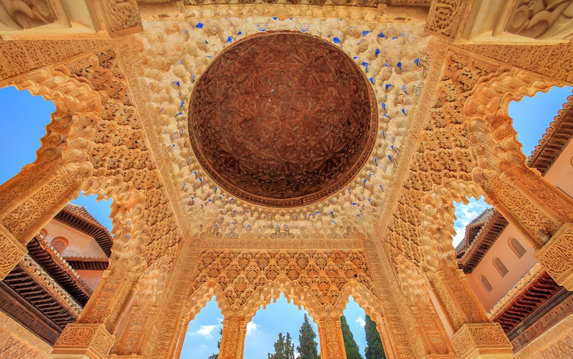 Alhambra's intricate ceiling in the Court of the Lions, Granada.
