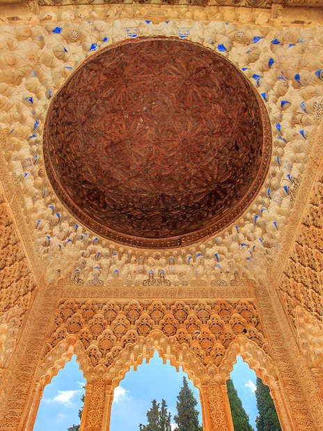Alhambra's intricate ceiling in the Court of the Lions, Granada.