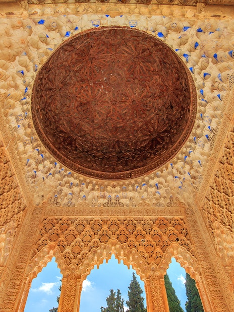 Alhambra's intricate ceiling in the Court of the Lions, Granada.