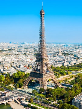 Eiffel Tower aerial view with Paris cityscape in the background.