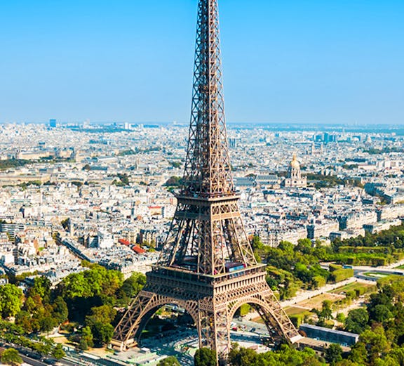 Eiffel Tower aerial view with Paris cityscape in the background.