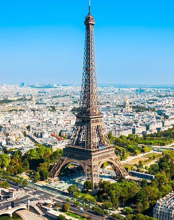 Eiffel Tower aerial view with Paris cityscape in the background.