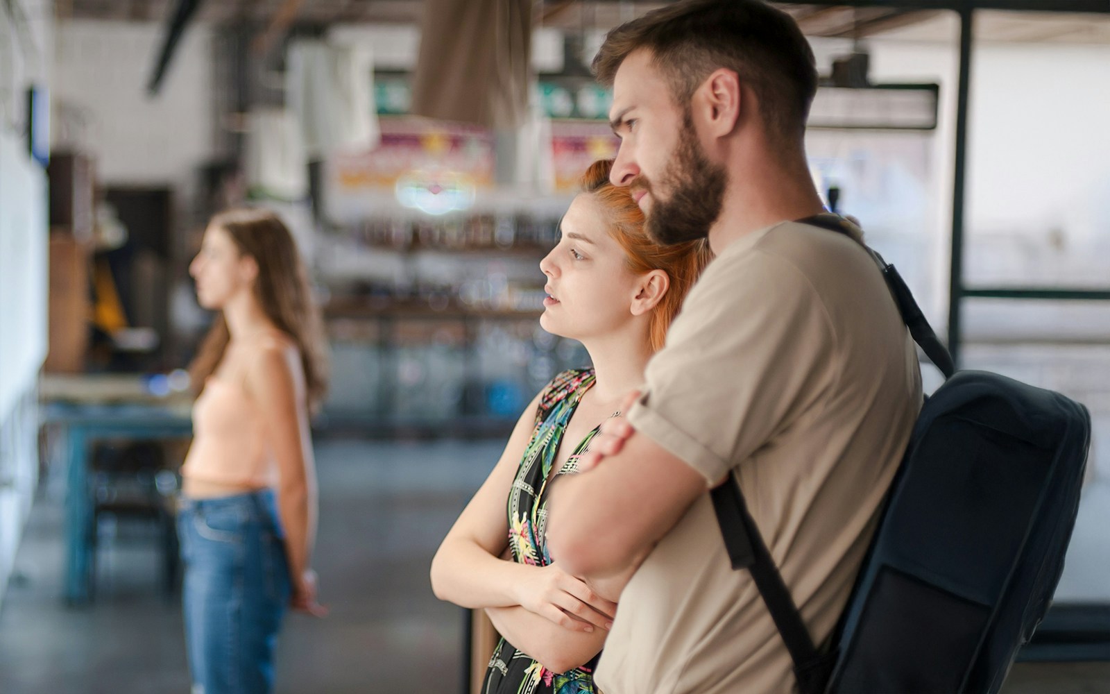 Visitors observing exhibits at a museum.