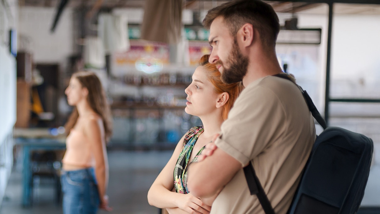 Visitors observing exhibits at a museum.