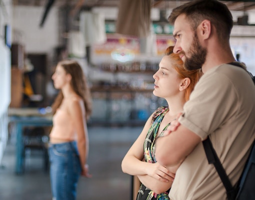 Visitors observing exhibits at a museum.