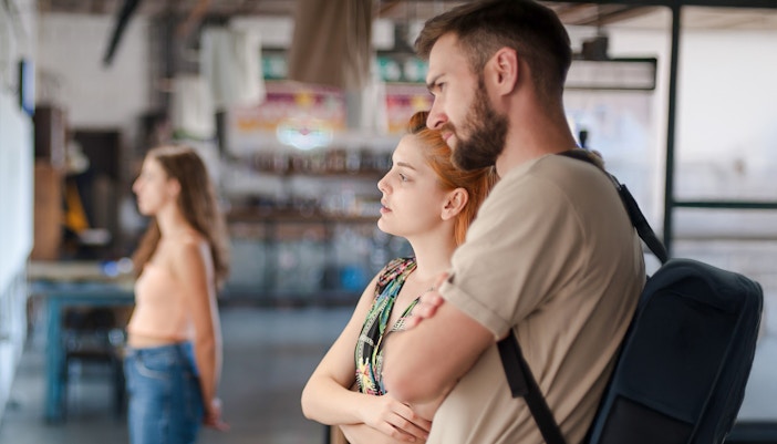 Visitors observing exhibits at a museum.