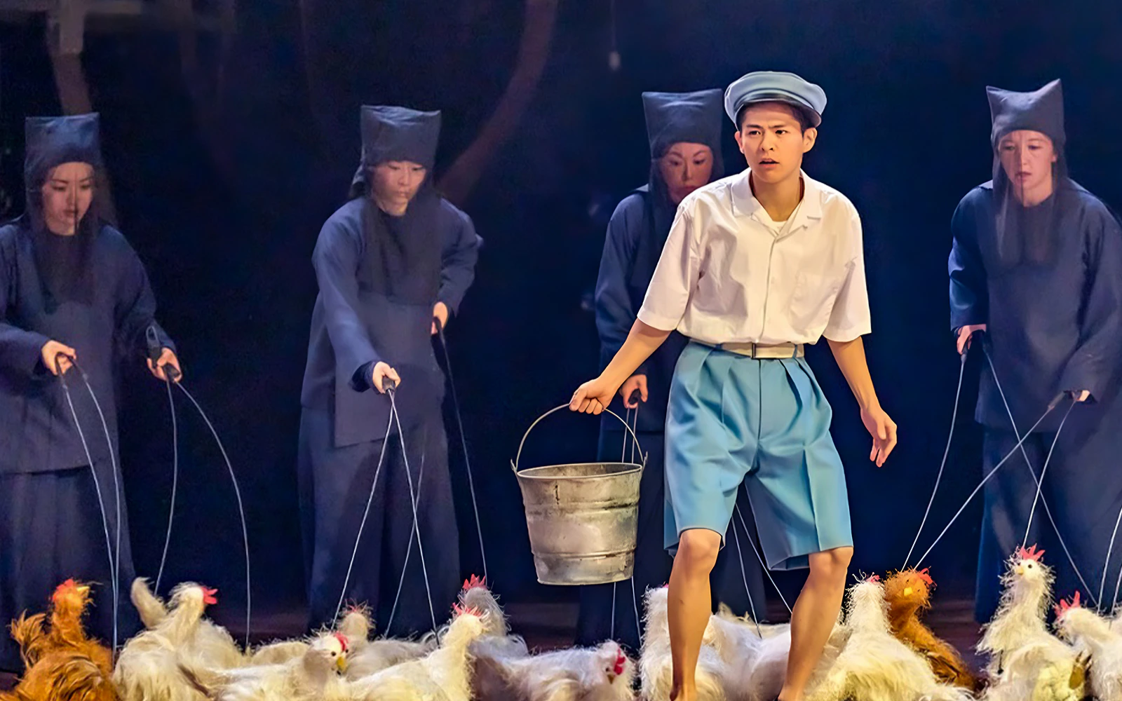 Stage performance of My Neighbour Totoro with actors and puppet chickens.