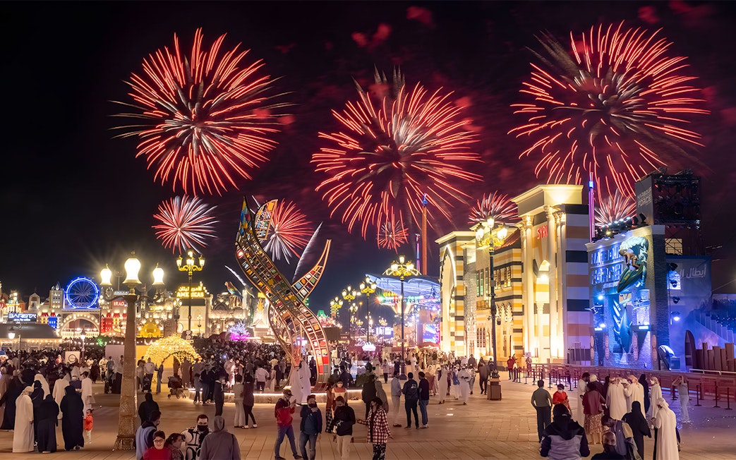 Fireworks display over Global Village Dubai during New Year's Eve celebration.