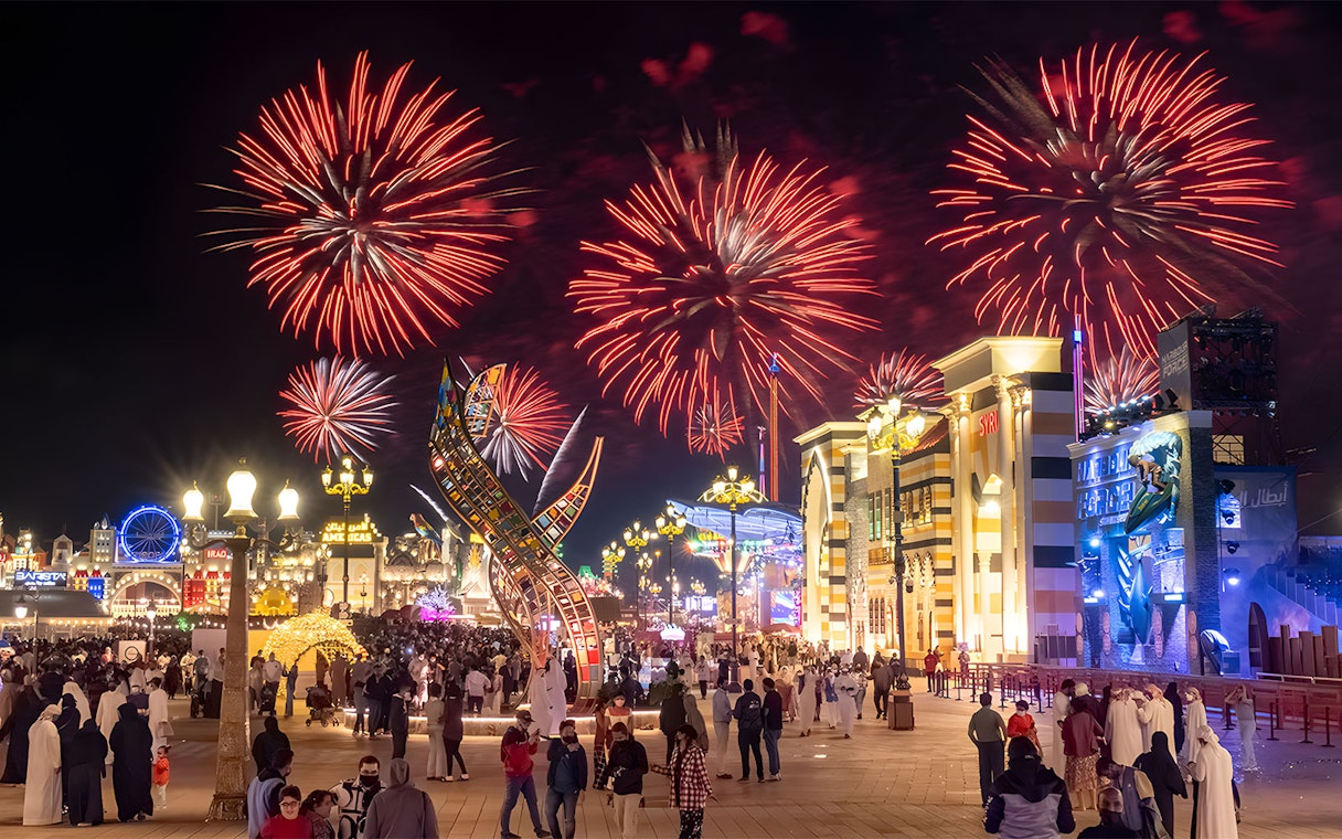 Fireworks display over Global Village Dubai during New Year's Eve celebration.