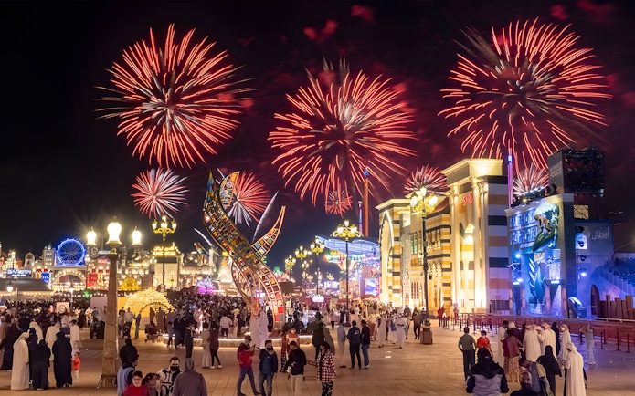 Fireworks display over Global Village Dubai during New Year's Eve celebration.