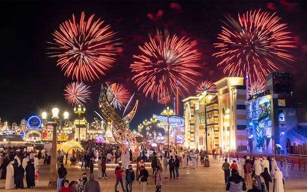 Fireworks display over Global Village Dubai during New Year's Eve celebration.