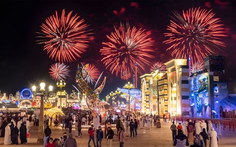 Fireworks display over Global Village Dubai during New Year's Eve celebration.