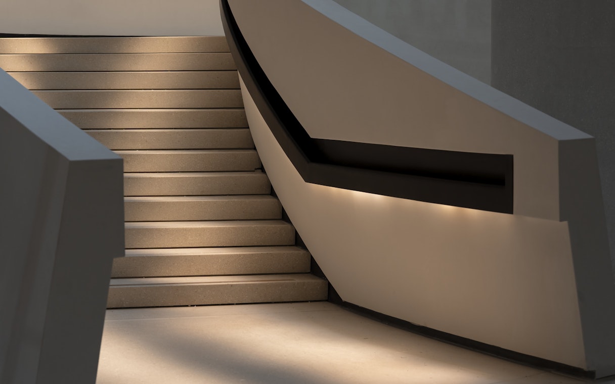 Staircase inside Zayed National Museum with modern design elements.